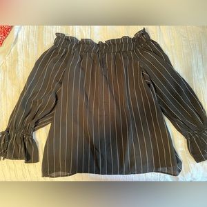 Gorgeous off the shoulder top in black with white stripes.
